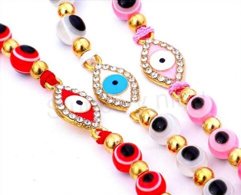 Šňůrkový náramek na ruku Swarovski elements oko s korálky oka bílý (BC581)