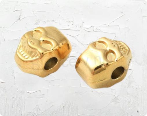 Nerezový korálek Lebka zlatý - mezidíl 10 x 7 x 6,5 mm (AA362)