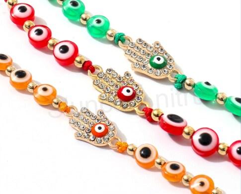 Šňůrkový náramek na ruku Swarovski elements ruka Fatimy - hamsa s okem světle růžový (BC582)