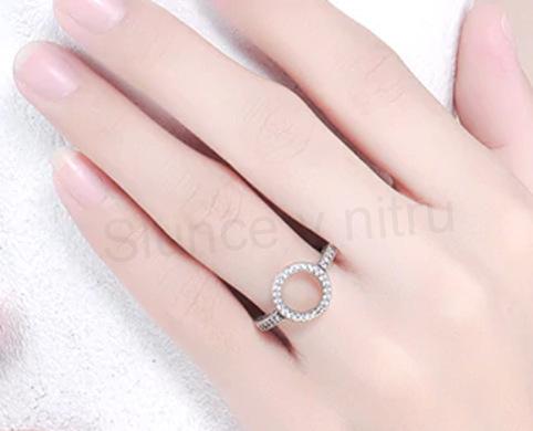 Postříbřený prsten s kruhem a zirkony (BE30)