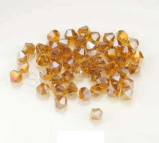 Korálky Swarovski Elements sluníčka, bicone | 4 mm jantarově hnědé | 10 kusů (AC346)